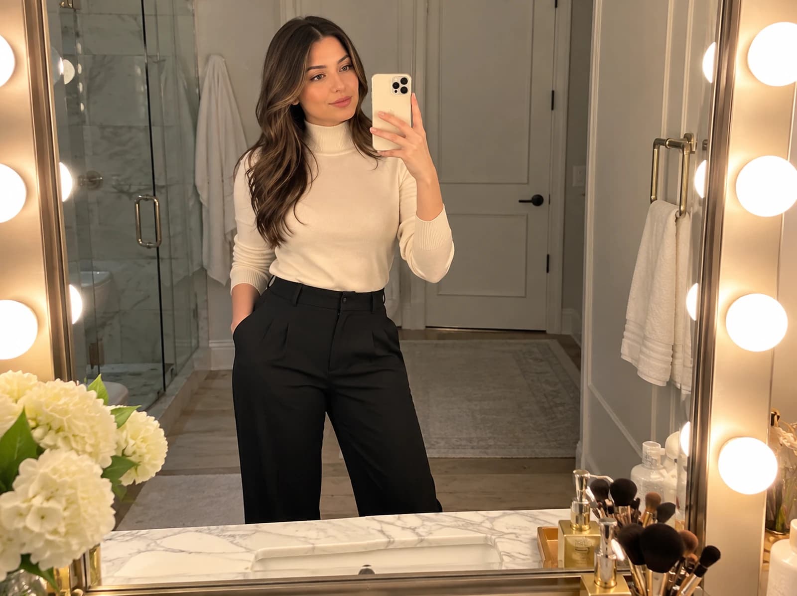Mirror selfie using warm vanity lighting